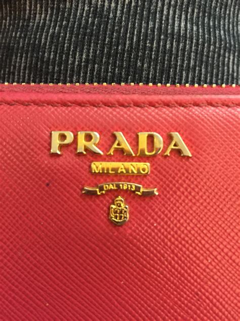 prada wallet fake vs real|how to find prada purse.